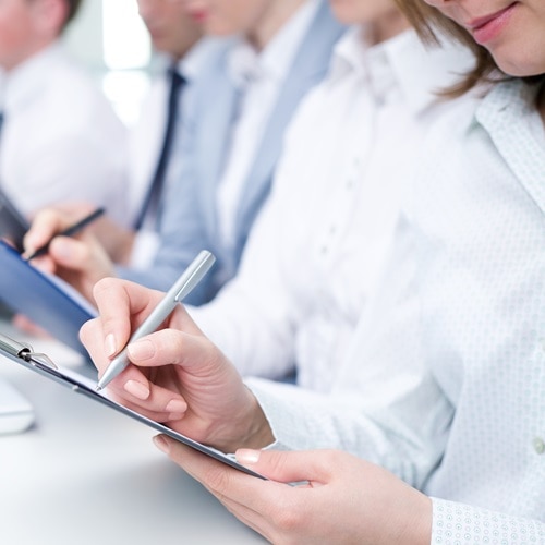 A2L refrigerants are a safe and sustainable choice for the environment - image of a person holding a small bottle of A2L refrigerant.