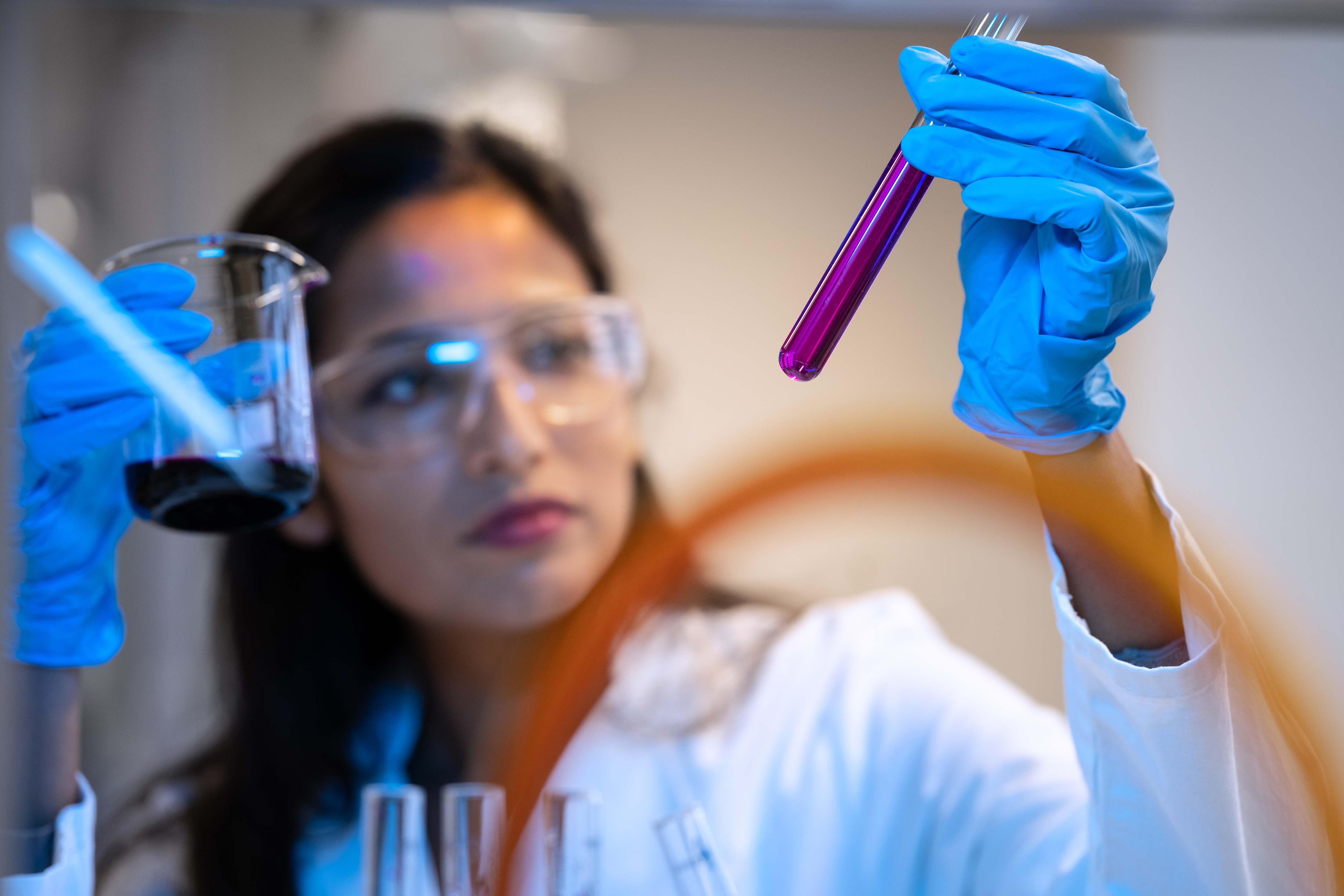 During chemistry lectures, students listen to lectures and do practical experiments in the chemistry laboratory. Portraits of professor and students, multi racial composition.